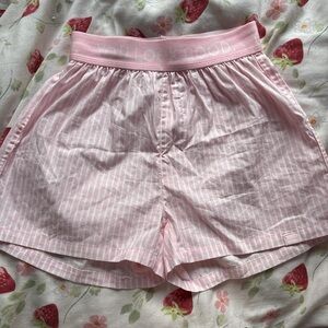 Glossier pink striped shorts